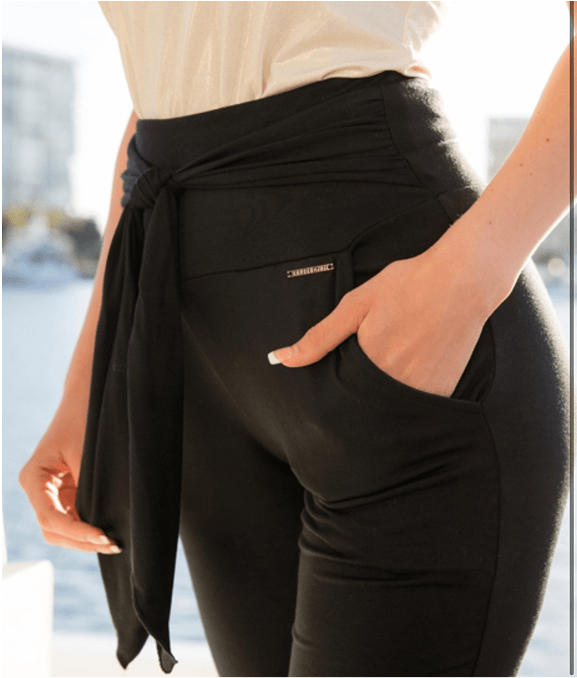 Person wearing black pants with a blurred background